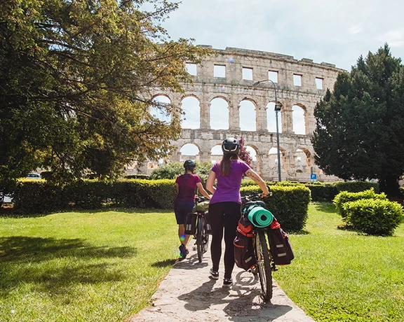 Take a break from your ride to visit the ancient theater of Pula.