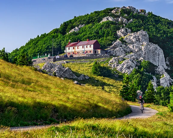 Challenge your legs and lungs and delight your eyes on bike trails in Velebit National Park.