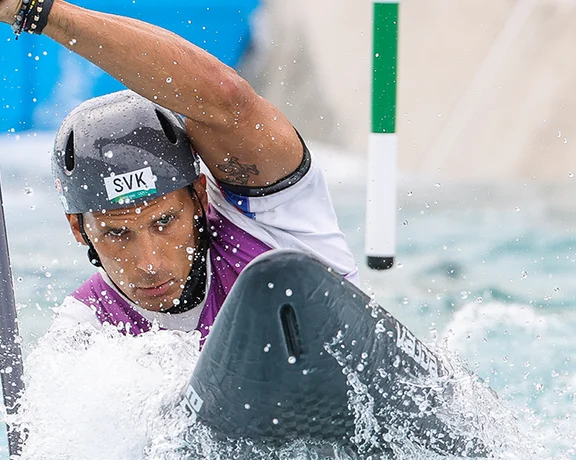 Bring a telephoto lens to capture the thrills of speed canoeing, as captured here during an Olympic event.