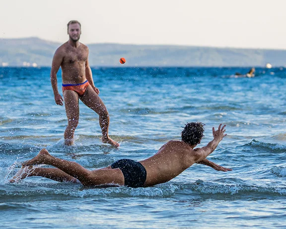 Enjoy splashing around to keep the ball in the air when you play picigin on the beach in Split.