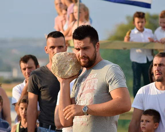 Imagine the sheer strength required to hurl a stone the winning distance during a game of plow!