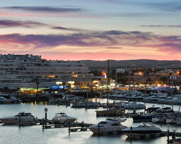 See beautiful sunsets over the Marina de Vilamoura in the Algarve after a day on the water.