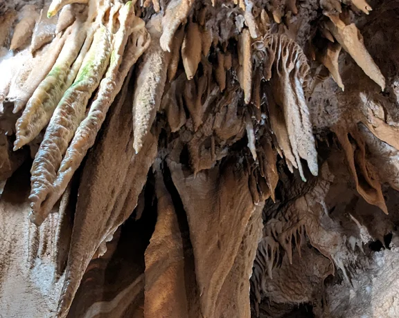 Look up and down to appreciate the fantastic formations of stalactites and stalagmites in Slovenia's caverns.