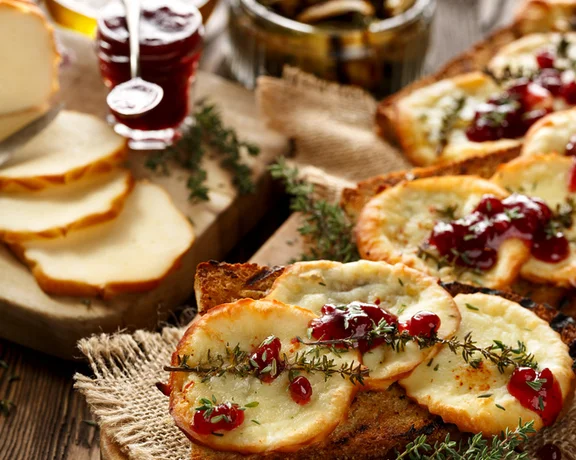 Experience a perfect combination of salty and sweet with grilled, smoked sheep’s cheese and a dollop of tart cranberry sauce.