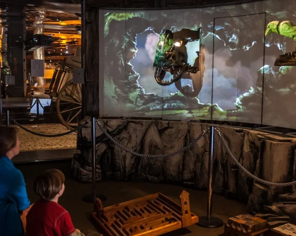 Interact with the fantasy dragon exhibit at Rynek Underground Museum in Kraków.