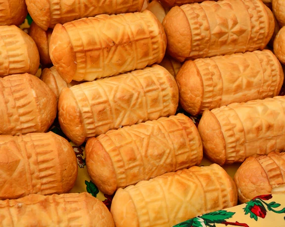 Take photos and taste Oscypek, a traditional, rustic, smoked sheep's mile cheese made exclusively in the Tatra Mountains region of Poland.