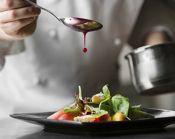 Book your table at Restaurante Feitoria, led by Chef João Rodrigues, for a fine dining experience that combines modern Portuguese cuisine with sustainable, locally sourced ingredients.