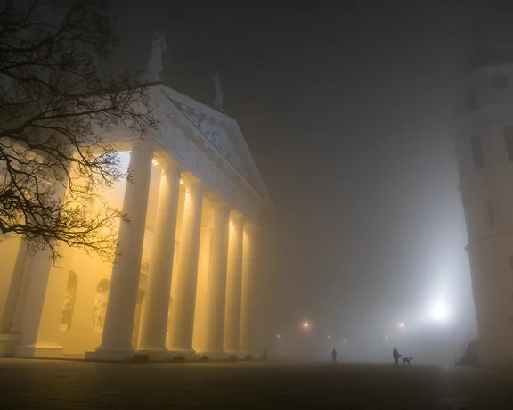 Vilnius Cathedral in Autumn surrounded by night fog..