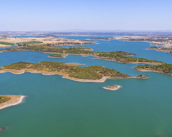 Aerial panorama of Alqueva Lake dotted with small islands.