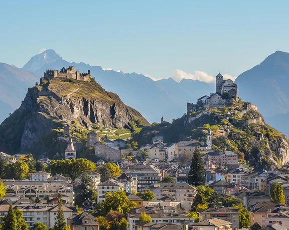 Sion landscape with the castles Valère and Tourbillon in the horizon.