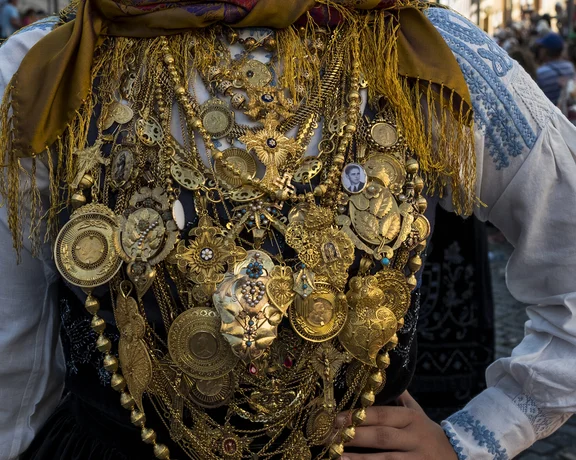 Traditional costume covered in ornate gold filigree jewellery.