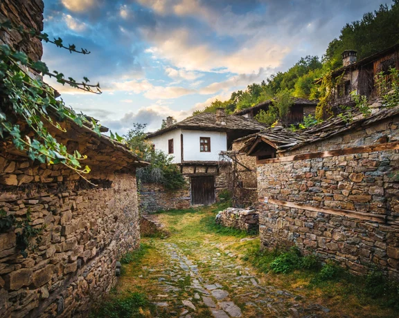 Stone houses and cobblestone lane in Kovachevitsa village, Bulgaria