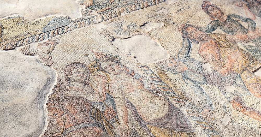 Ancient mosaic floor depicting human figures, from a historical site, Kato Pafos, in Cyprus.