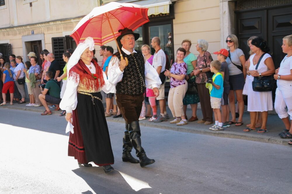 See proudly dressed locals on National Costume days, Slovenia