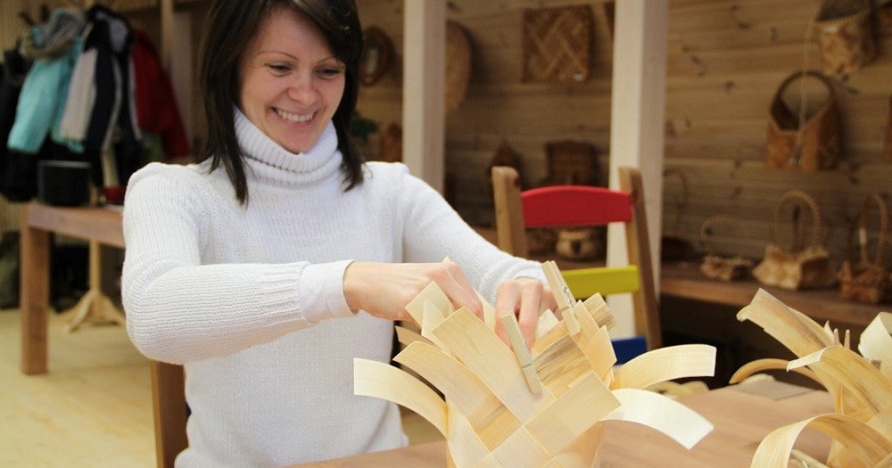 A woven chipwood basket in the making © Visit Estonia