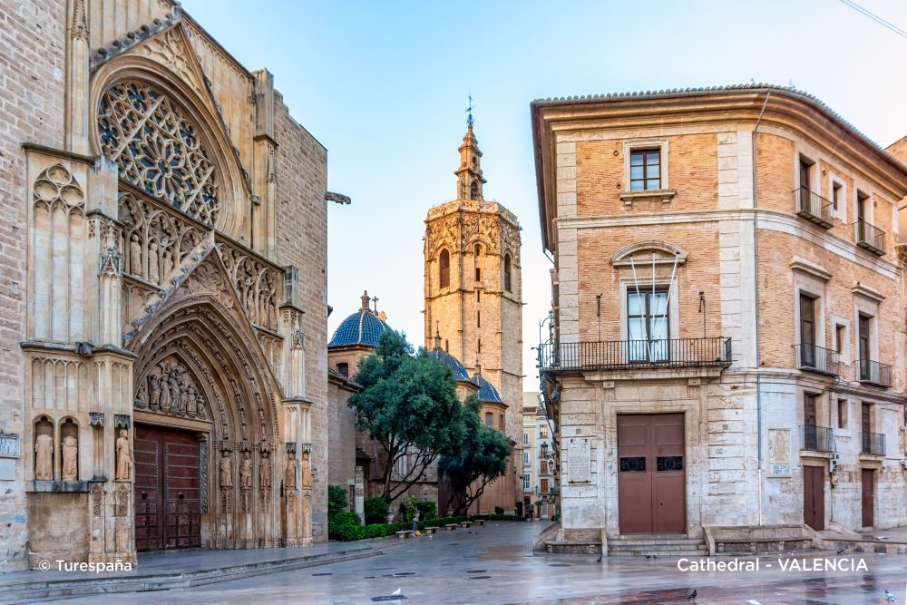 Close-up perspective of Valencia Cathedral’s intricate architecture framed in a narrow shot.