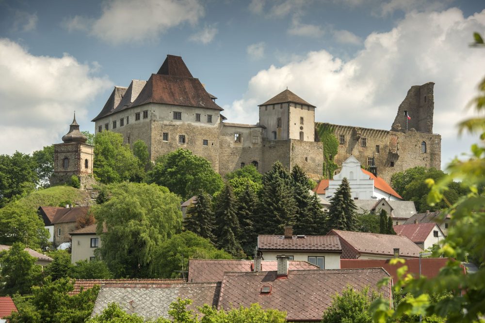 Lipnice nad Sázavou Castle on a rocky hill, historic stone walls overlooking the town below”