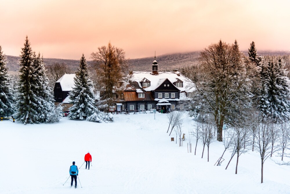 Glide along a white trail at the old wooden hunting chateau at Nová Louka near Bedrřichov in the Jizera Mountains 