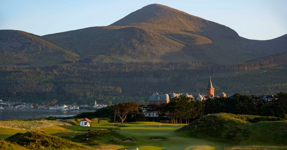 Take your clubs onto the green at the Royal County Down golf course at the foot of the Mourne Mountains, County Down. 