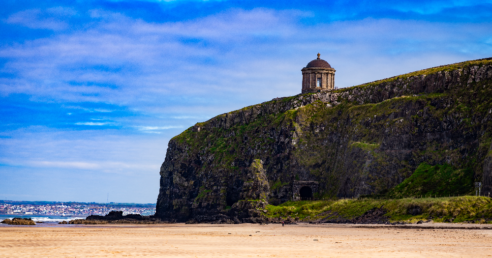 Mussenden Temple perched on dramatic sea cliffs overlooking the beach in County Londonderry, Northern Ireland