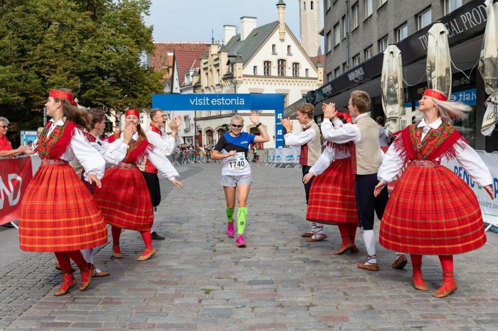 Delight in local color in Tallinn’s Old Town when Estonian folk dancers entertain for the Tallinn Marathon. 